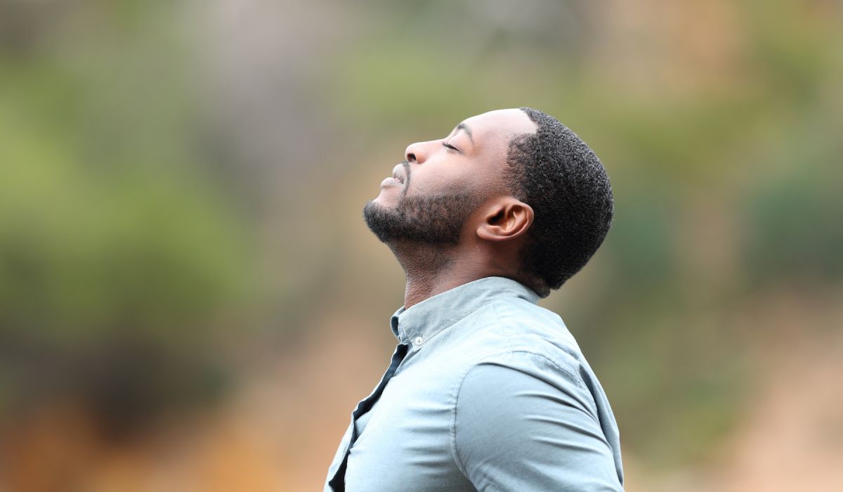 man using breathing as a tool to deal with anxiety during the holidays