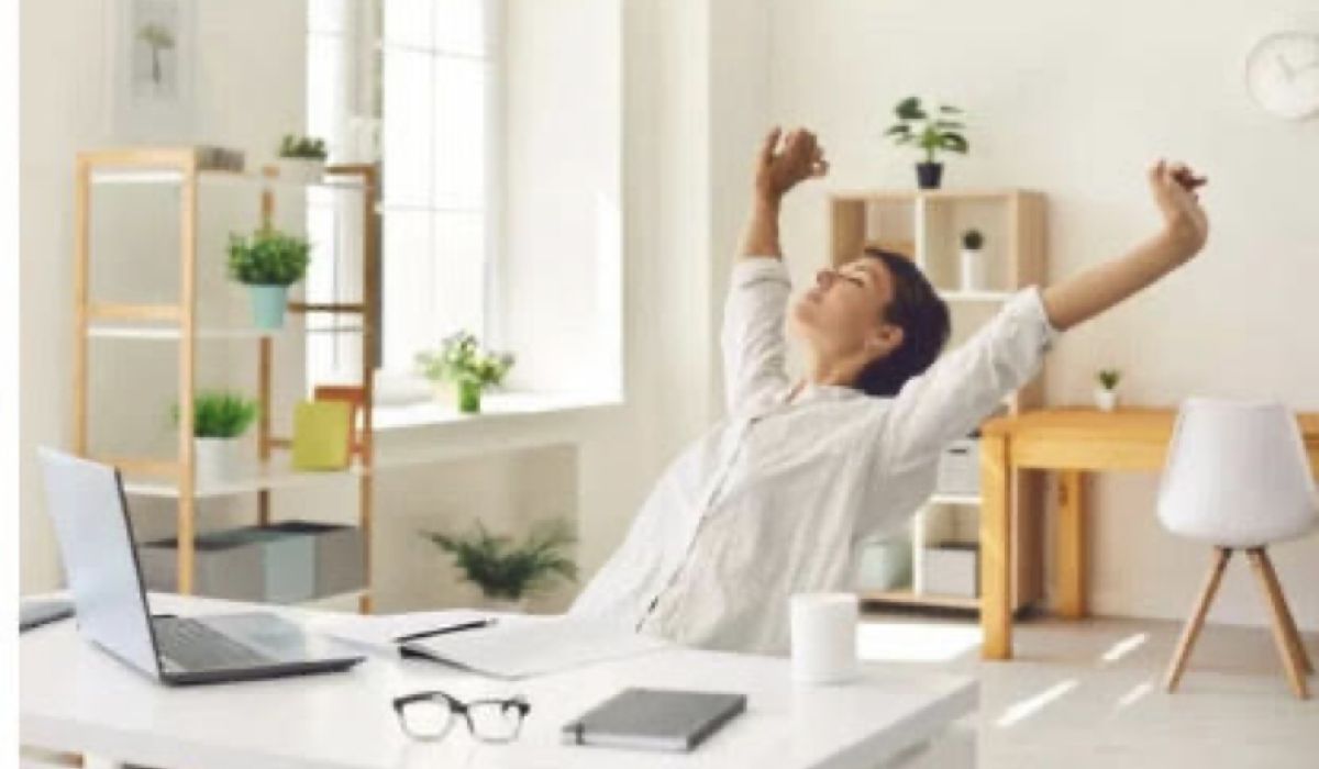 woman stretching at desk learning healthy ways to move through feelings of anxiety