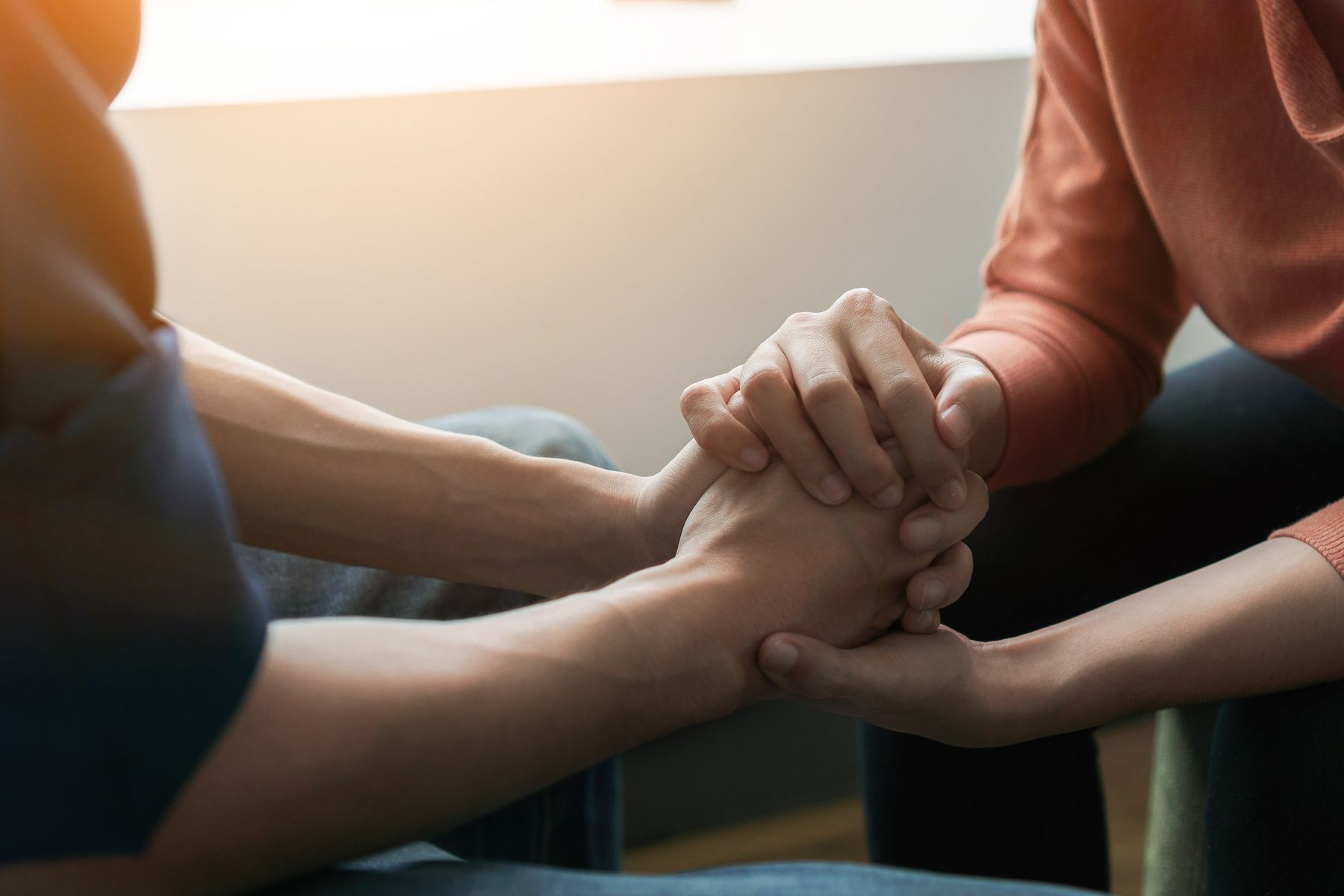 Person comforting perfectionist, holding hands
